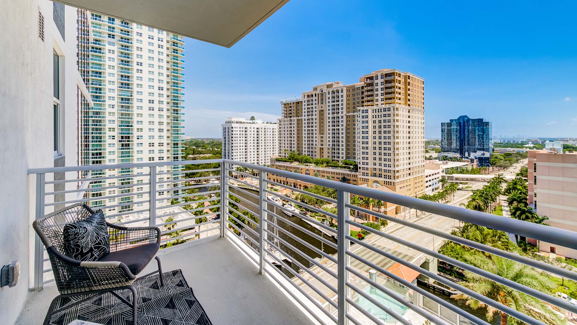Apartment balcony with outdoor furniture overlooking East Fort Lauderdale.